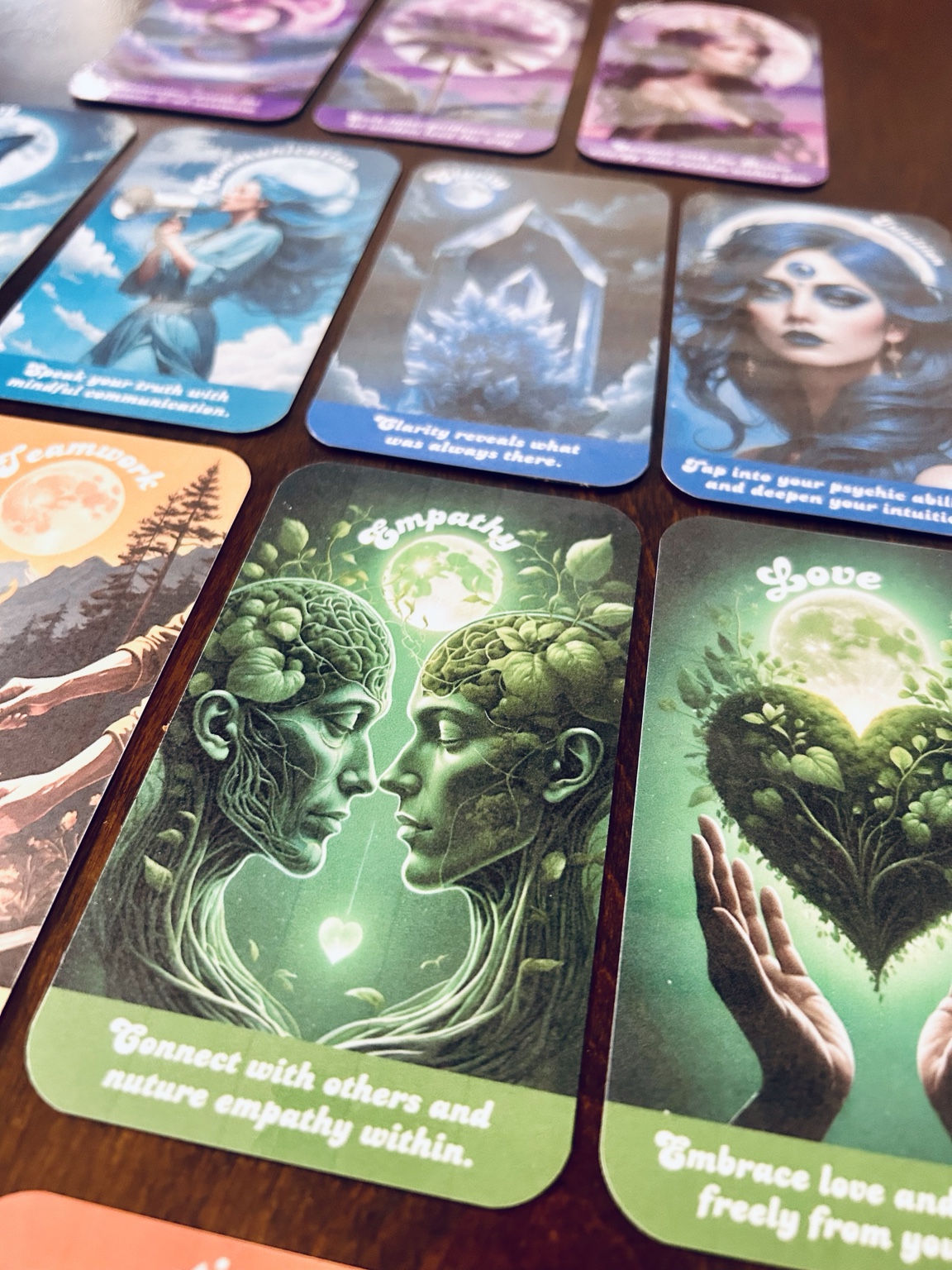 Close-up of Chakra Energy Oracle cards in several chakra colors